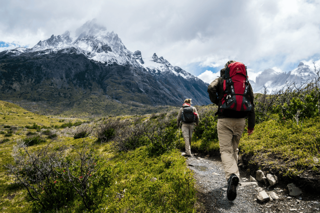 a photo of two people hiking for fitness