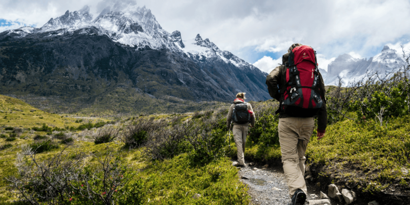 a photo of two people hiking for fitness