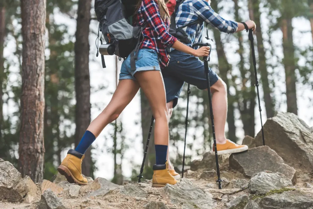 a very fit couple hiking on a rocky trail